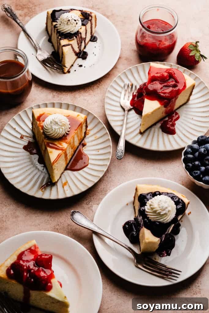 Velvety Rich New York Cheesecake Masterpiece 14 An array of New York Style Cheesecake slices, each with a different tempting topping, displayed on individual plates.