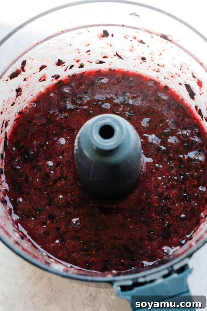 Blueberry Bliss Cake 5 Pulverized blueberries in a food processor, transformed into a liquid.