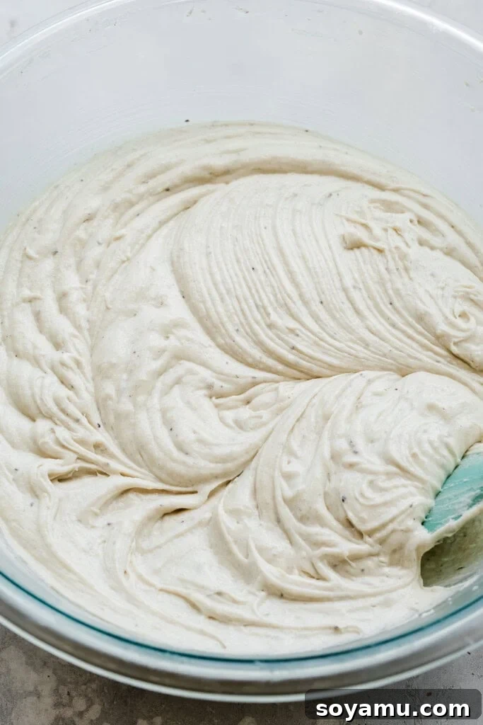 Blueberry Bliss Cake 10 Silky cake batter after the eggs have been added, showing a pale, smooth consistency.