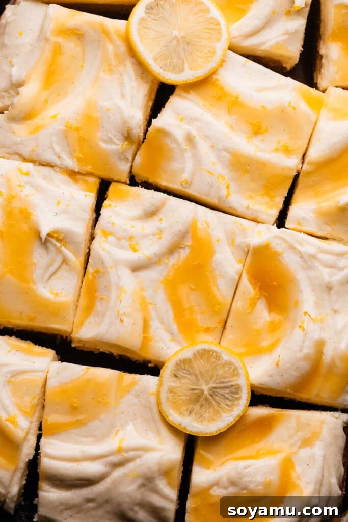 Velvet Lemon Mascarpone Cake 13 A delicious slice of lemon curd cake on a plate, with a fork, ready to be eaten.