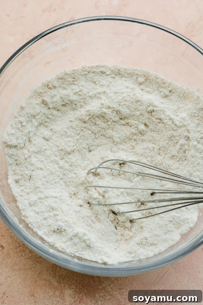 A bowl of dry ingredients, perfectly whisked together and ready for the next step in making vanilla cupcakes.
