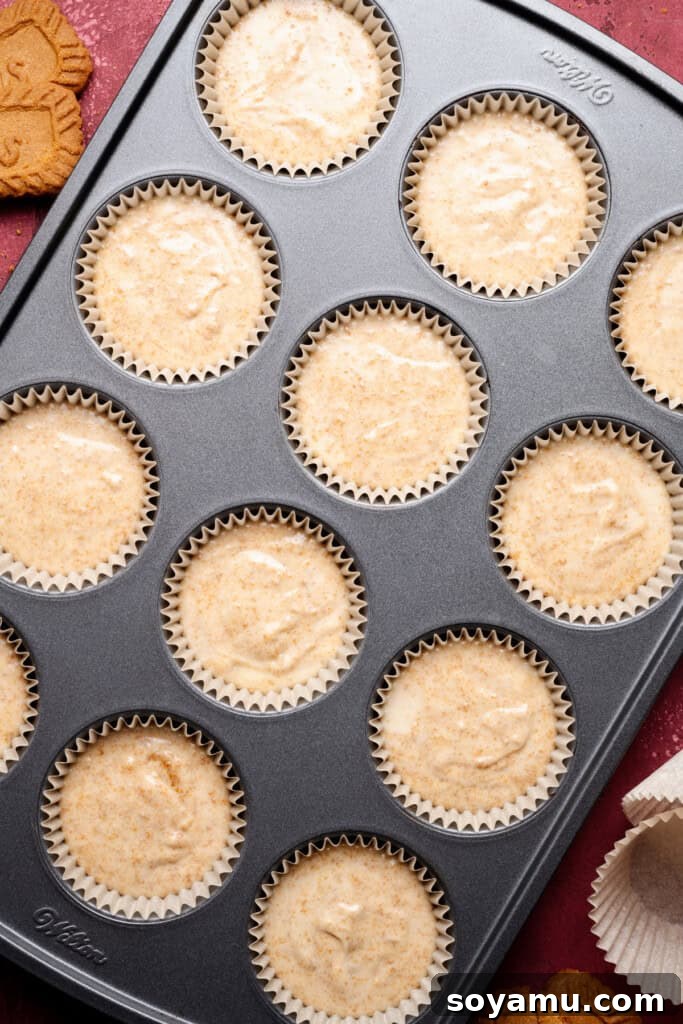Biscoff Overload Cupcakes 9 Cupcake batter in the pan, ready to be baked.