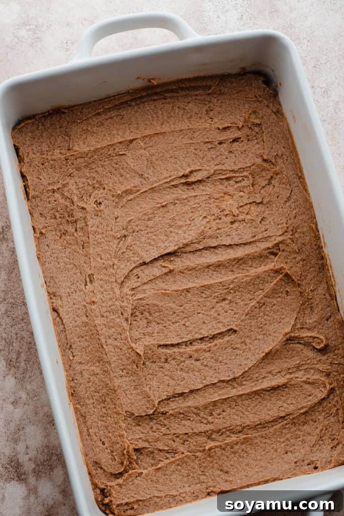 Caramel pan sauce evenly spread in the bottom of a 9x13 baking pan.