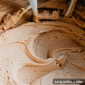 Luscious peanut butter frosting in the bowl of a stand mixer, ready to be used.