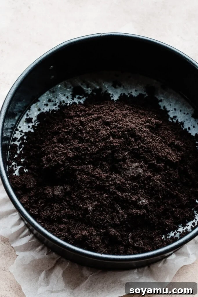 Simple Two Ingredient Oreo Dessert Crust 5 The dark, sandy mixture of crushed Oreo cookies and melted butter, perfectly combined and ready to be pressed into a pan.
