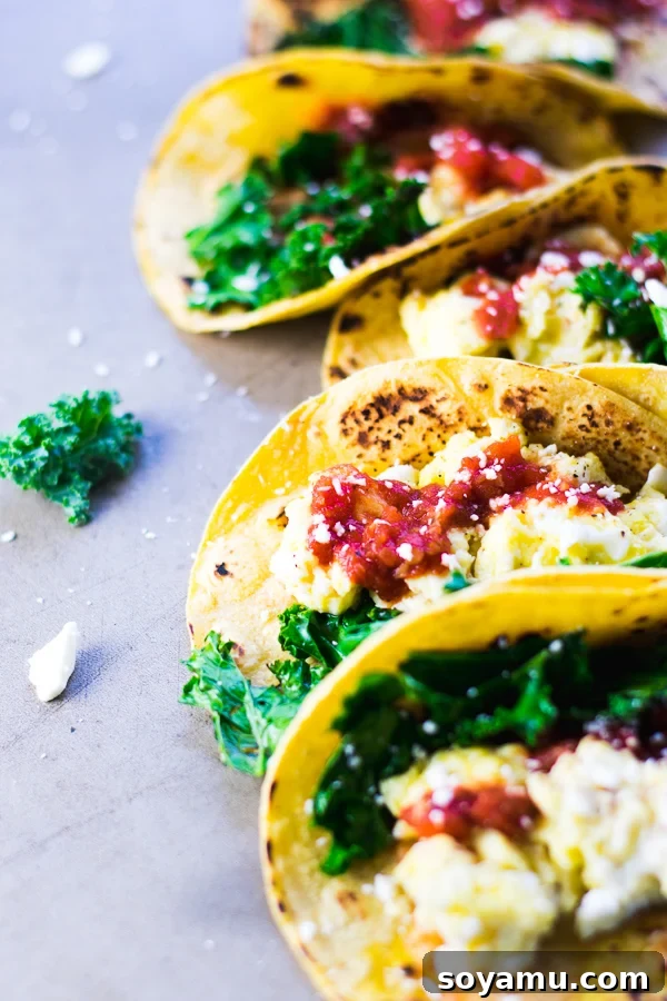 Two breakfast tacos ready to be enjoyed.