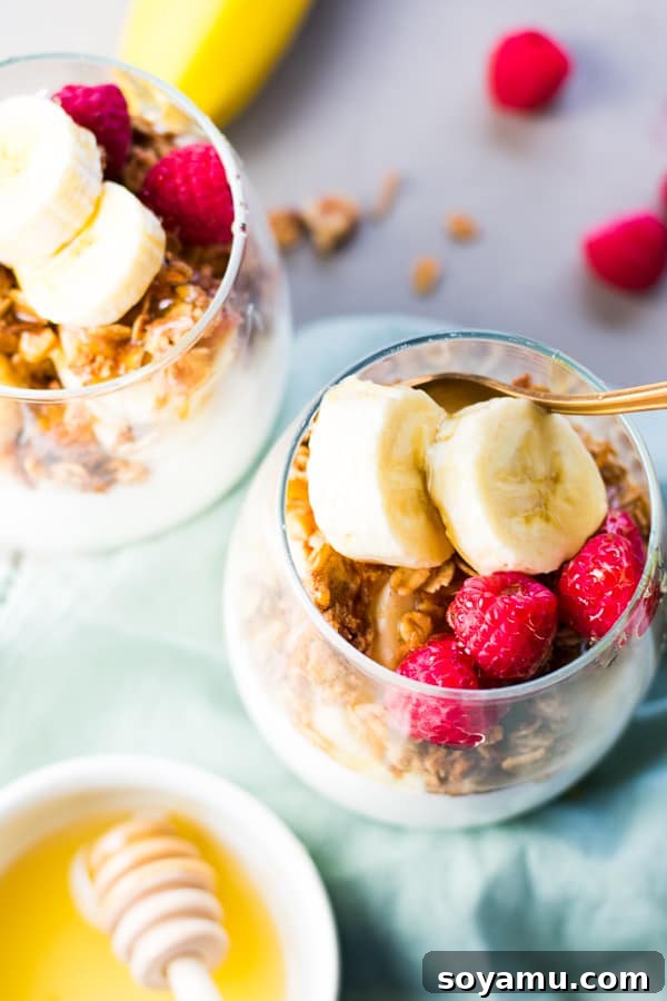 Easy 5-Minute Layers of Honey Granola and Fruit 4 Close-up of fresh raspberries and honey in a breakfast parfait