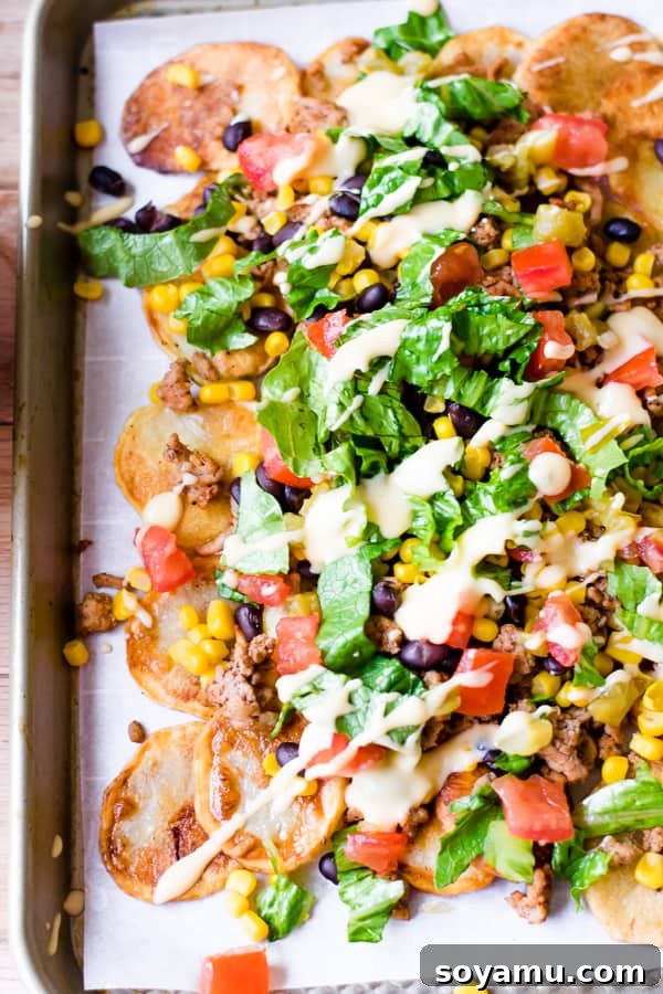 One-Pan Nacho Feast 2 Loaded Sheet Pan Nachos with homemade chips and cheese sauce