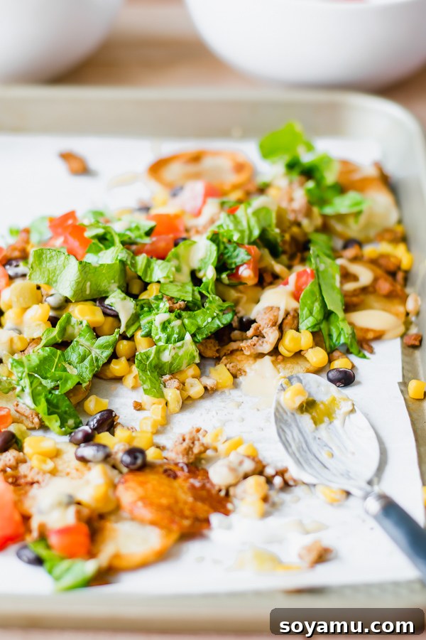 One-Pan Nacho Feast 9 Overhead view of perfectly loaded sheet pan nachos