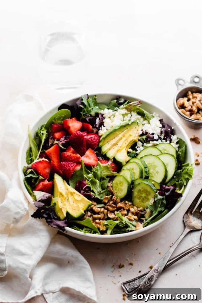 Vibrant Strawberry Cucumber Salad with Goat Cheese and Toasted Walnuts 3 A bowl with the salad ingredients before being tossed.