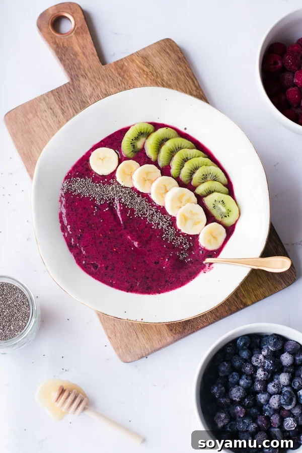 A beautifully presented 5-Minute Smoothie Bowl with fresh fruit and seeds