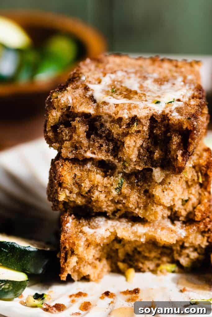 A stack of zucchini bread pieces showing the fluffy moist texture.