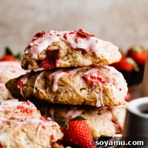 A stack of strawberry glazed strawberry scones, inviting and delicious.