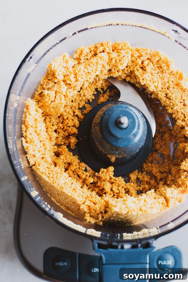 Freshly Made Peanut Butter 4 Peanuts forming a ball in the food processor