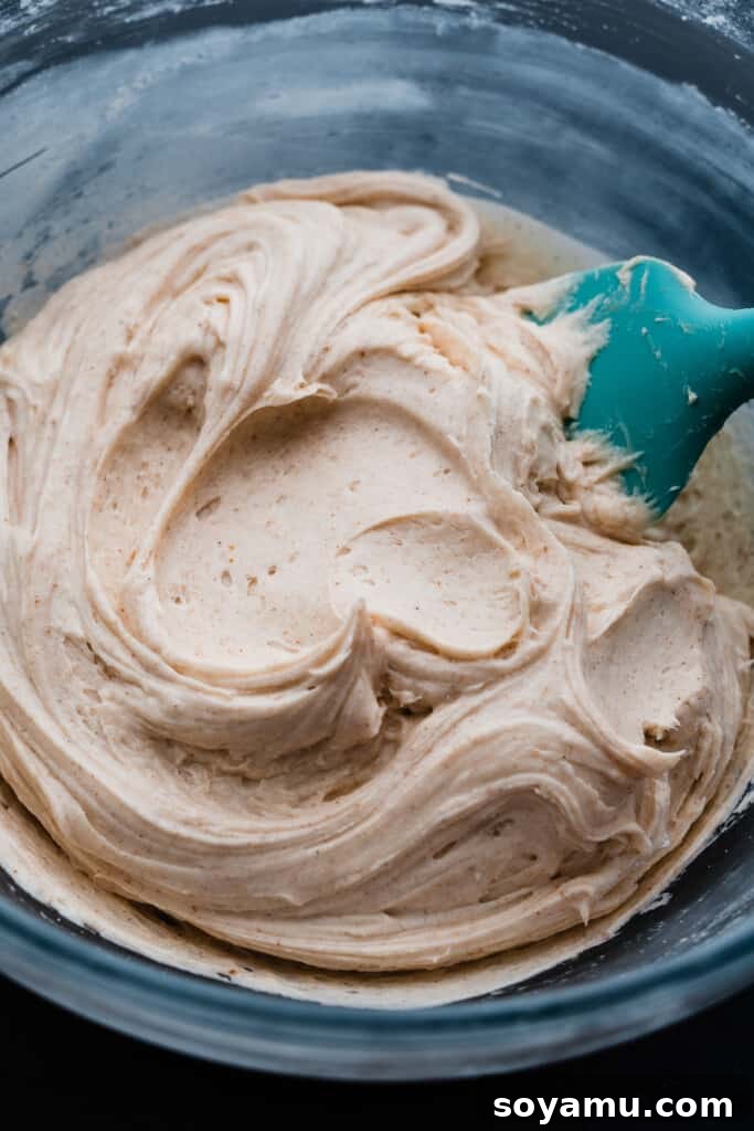 Decadent Baileys Chocolate Cake with Silky Cream Cheese Frosting 7 A bowl of creamy baileys frosting.
