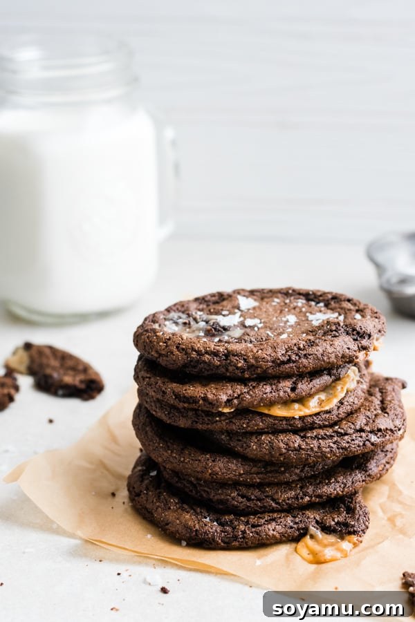 Last look at a perfect caramel-stuffed chocolate cookie, ready to be devoured. A final close-up of a Caramel-Stuffed Chocolate Cookie, highlighting its textures and rich color.