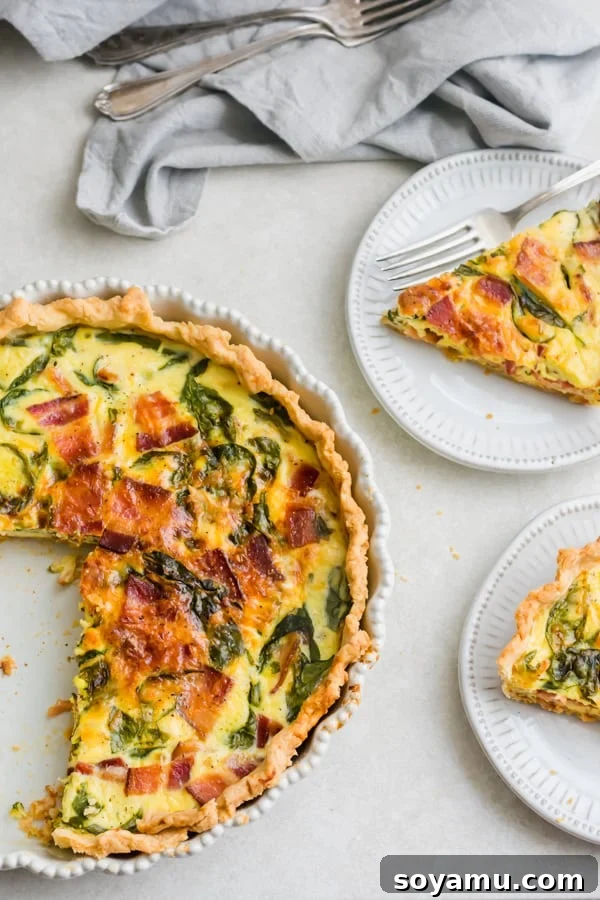 The Ultimate Breakfast Quiche 2 The perfectly baked quiche, sliced and ready to be served, with individual slices on plates nearby.