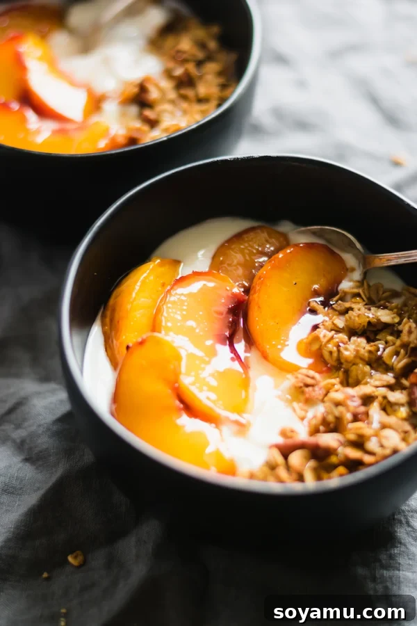 Peach Crisp Yogurt Parfaits 7 A perfectly assembled peach crisp yogurt bowl, ready to be enjoyed.