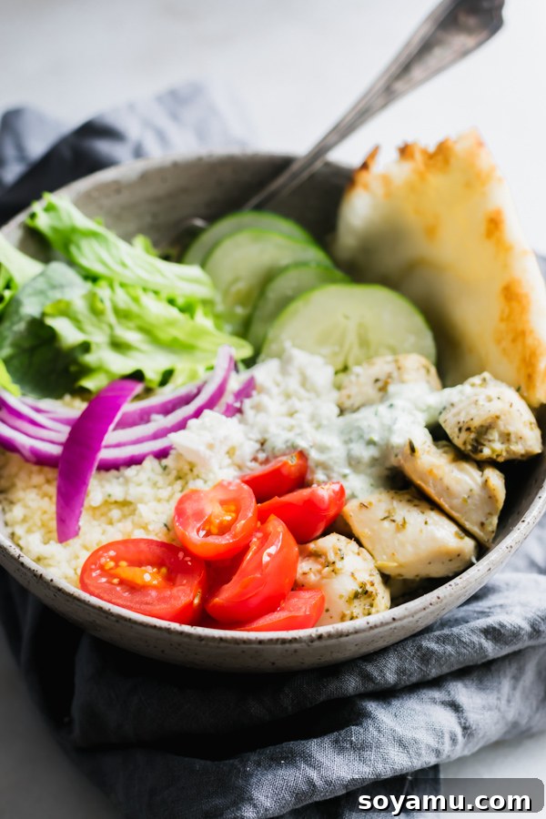 Savory Chicken Gyro Bowls with Artisan Tzatziki 6 A close-up of a chicken gyro bowl, showing the vibrant colors of the ingredients and the creamy tzatziki sauce.