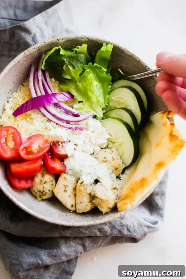 Savory Chicken Gyro Bowls with Artisan Tzatziki 7 A vibrant and healthy chicken gyro bowl with lemon-herb chicken, couscous, a medley of fresh vegetables, and creamy tzatziki sauce on top.