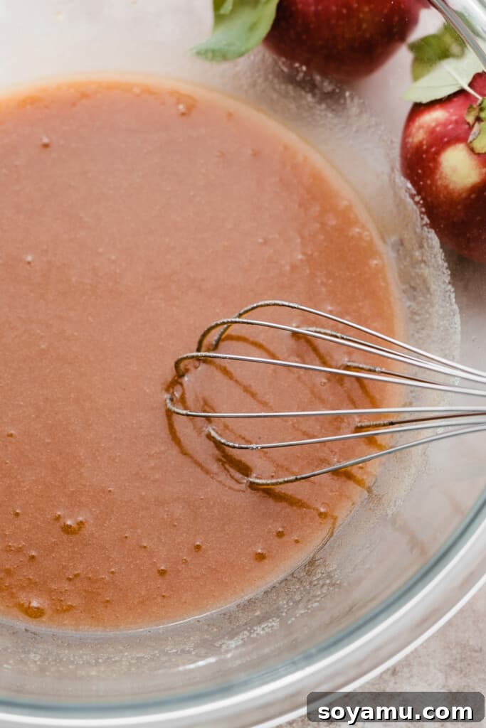 Ultimate Baked Apple Cider Donuts 6 A bowl of the wet ingredients whisked together.