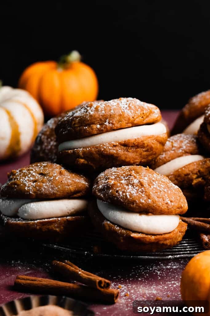 Brown Butter Pumpkin Whoopie Delights 2 Pumpkin whoopie pies piled on a vintage rack, showcasing their abundance and rustic charm.