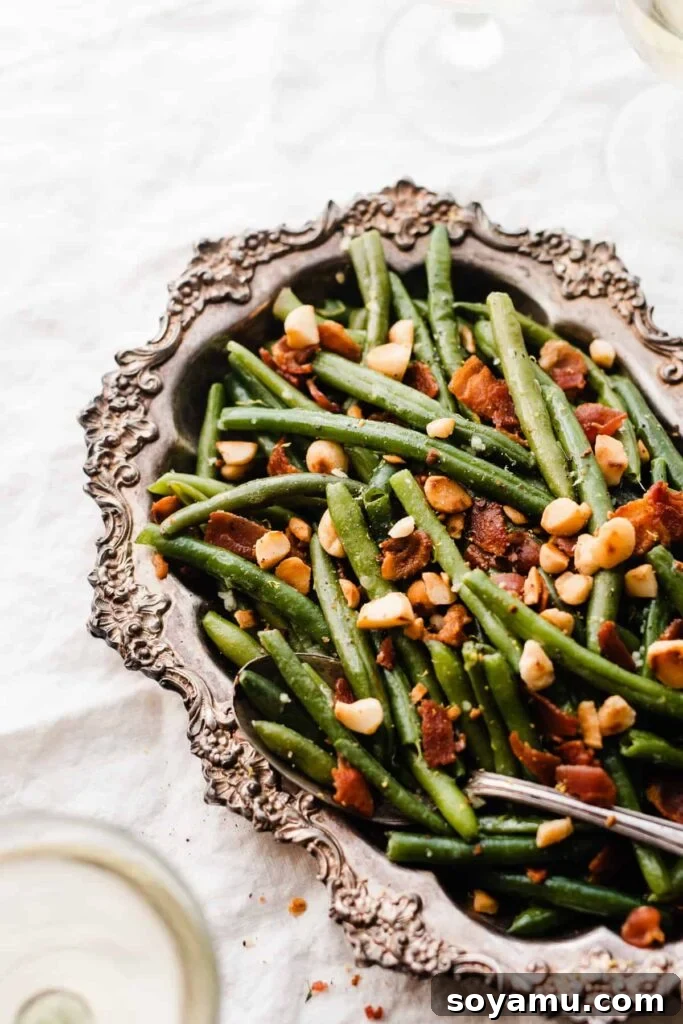 Effortless Gluten-Free Dairy-Free Bacon Green Beans 3 A close-up of a serving spoon digging into the bacon green beans.