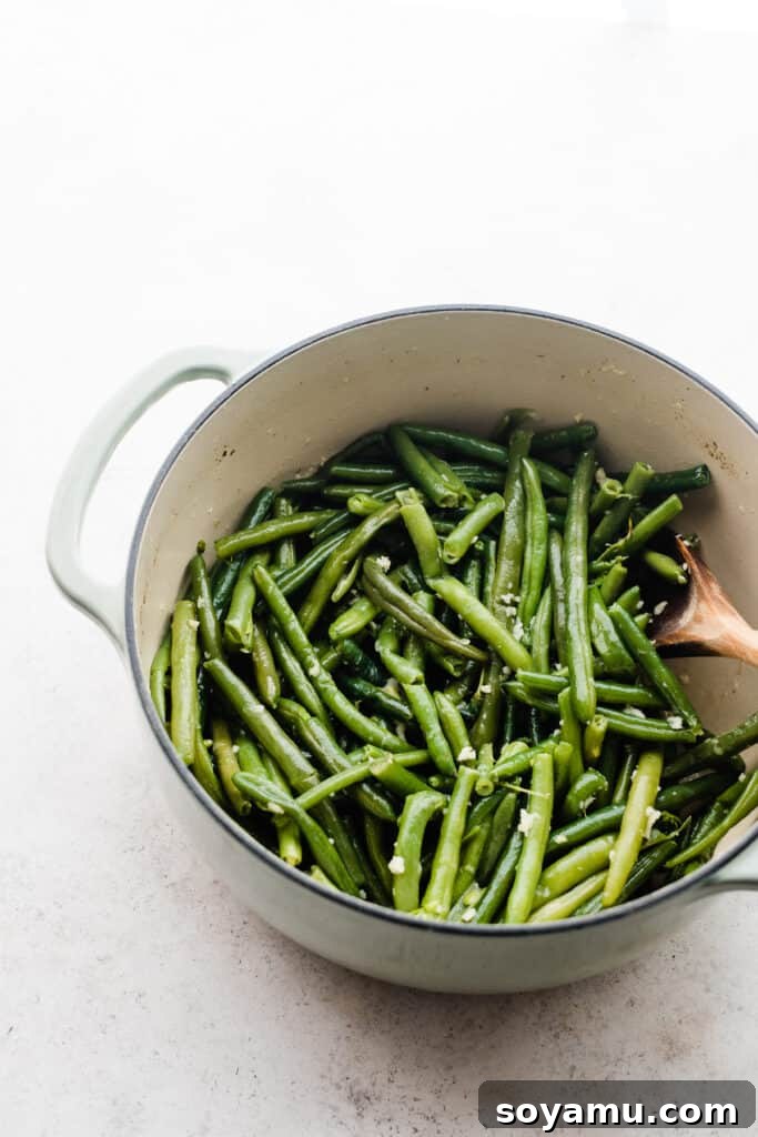 Effortless Gluten-Free Dairy-Free Bacon Green Beans 6 Cooked green beans in a dutch oven.