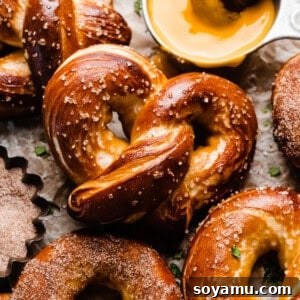 The golden brown, baked pretzels on a vintage wire rack.