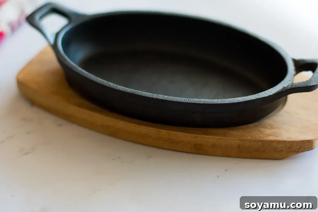 Intimate Peach Blackberry Crisp 2 A small cast iron skillet filled with a baked fruit crumble, freshly out of the oven.