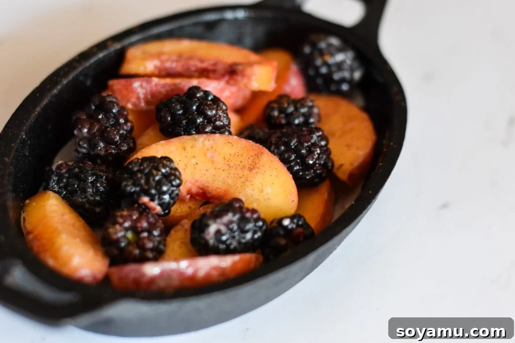 Intimate Peach Blackberry Crisp 3 Close-up of fresh peaches and blackberries, key ingredients for the crumble.