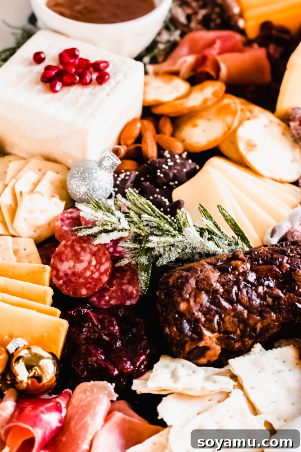Another perspective of a bountiful cheese and appetizer board A beautifully presented cheese board from another angle, showcasing its full glory.