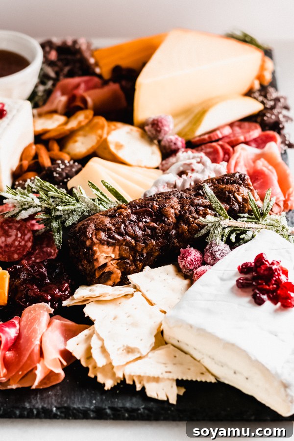 A detailed view of a gourmet cheese and meat platter A close-up shot of a lavish cheese board, highlighting the fresh and inviting ingredients.