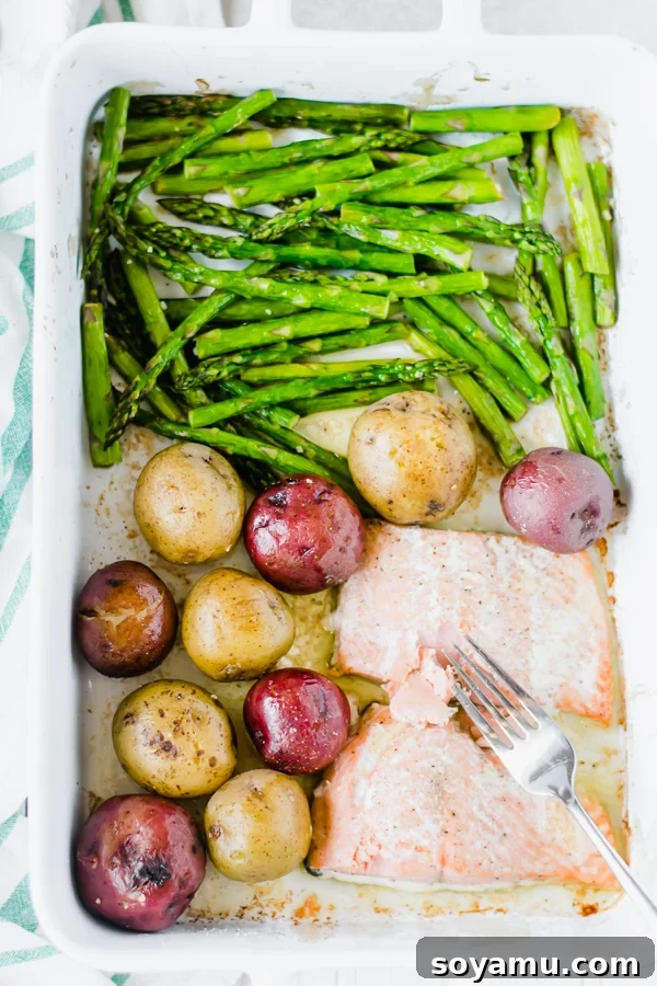 One Pan Garlic Butter Salmon with Asparagus and Potatoes - Quick and healthy seafood dinner. One Pan Garlic Butter Salmon with Asparagus and Potatoes, a complete and flavorful meal baked on a single sheet.