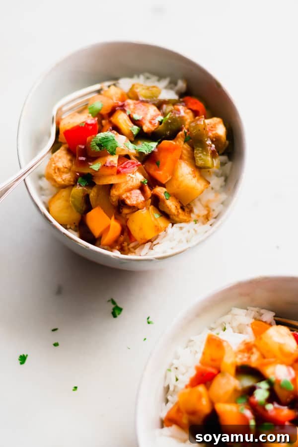 One Pan Chicken and Veggie Dinner - Easy and Whole30 compliant chicken recipe. A colorful One Pan Chicken and Veggie Dinner with bell peppers, pineapple, and barbecue sauce, baked together.