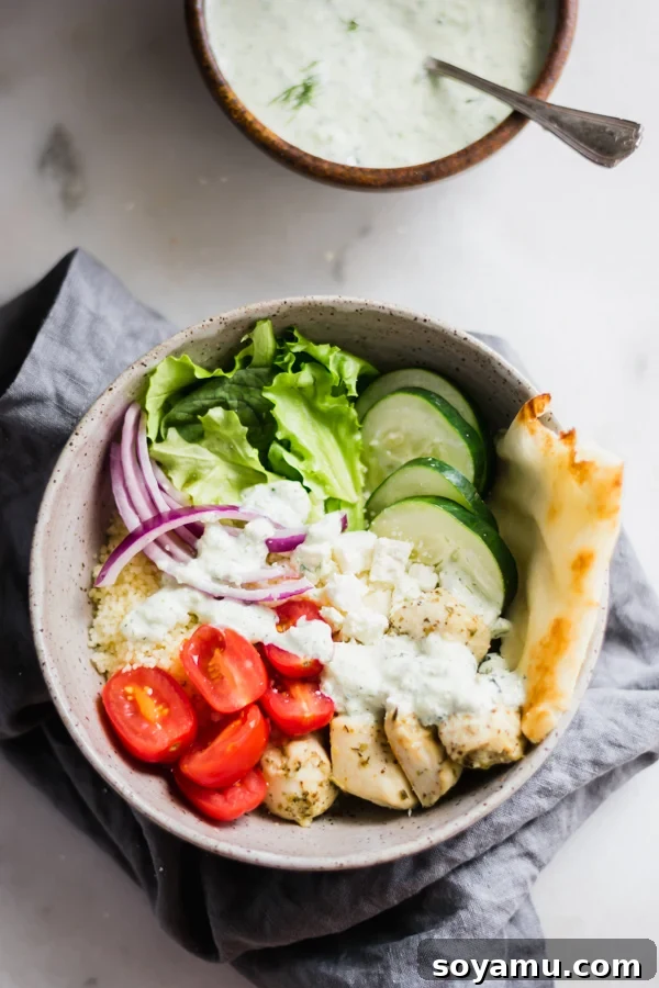 Chicken Gyro Bowls with Homemade Tzatziki Sauce - Fresh and healthy Mediterranean-inspired meal. Colorful Chicken Gyro Bowls with Homemade Tzatziki Sauce, featuring marinated chicken, fresh vegetables, and couscous.