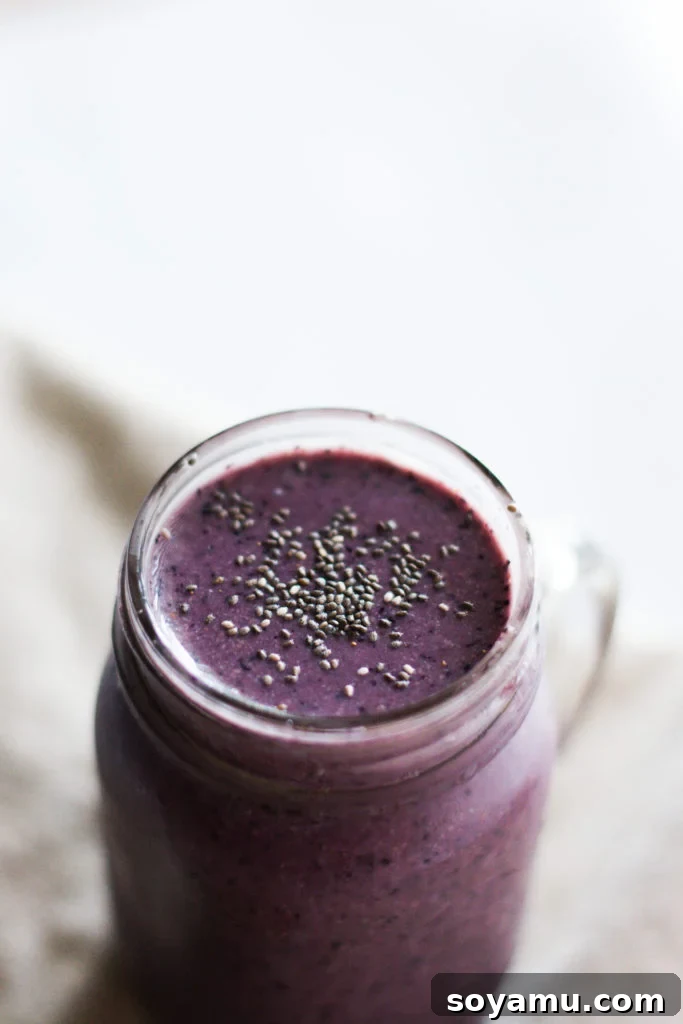 Super Healthy + Easy Smoothies 4 Ways - Versatile and nutritious breakfast options. Four vibrant Super Healthy and Easy Smoothies, each with unique ingredients like berries, greens, and fruits.