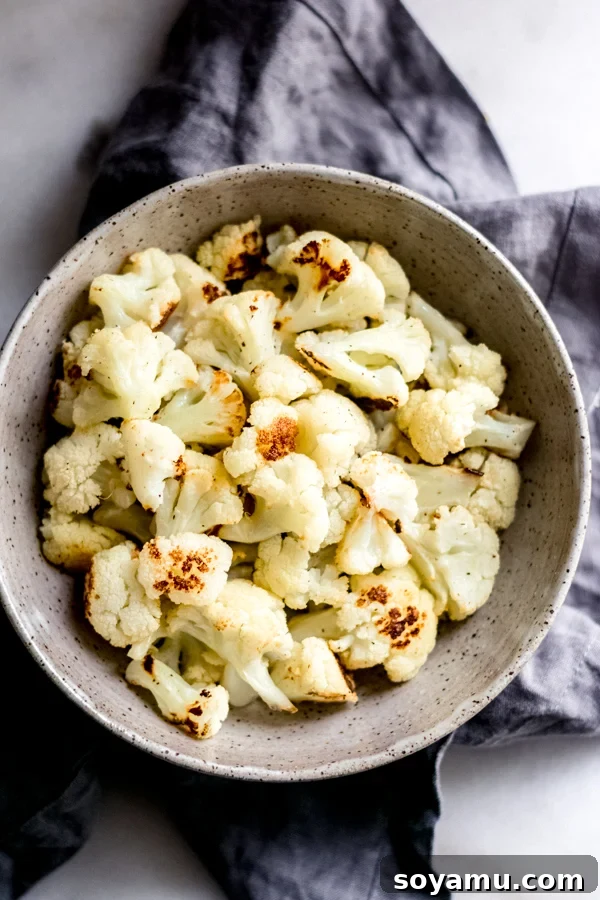 Quick Roasted Cauliflower - Vegan, gluten-free, and healthy vegetable side. Perfectly roasted Quick Roasted Cauliflower florets, lightly caramelized and seasoned.
