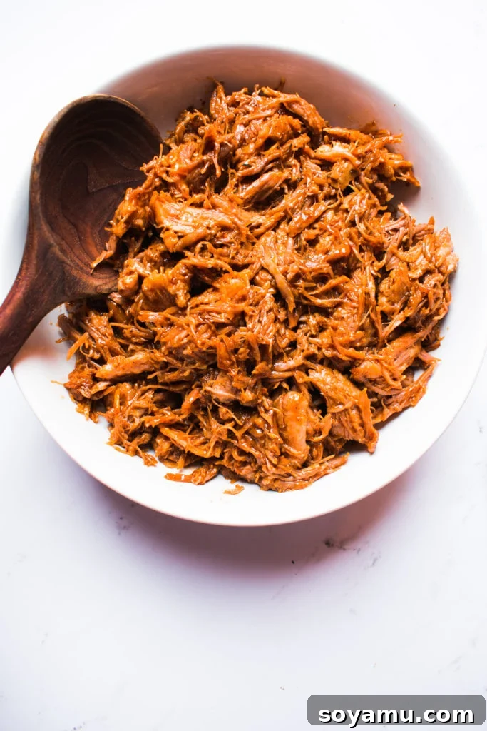 Instant Pot Pulled Pork - Versatile and flavorful for various meals. Shredded Instant Pot Pulled Pork piled high, ready to be served in tacos or salads.