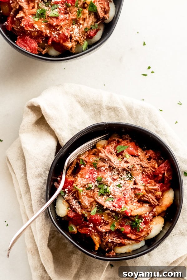 Braised Beef with Tomatoes and Gnocchi Fork tender braised beef with tomatoes and fluffy gnocchi, topped with fresh parmesan cheese.