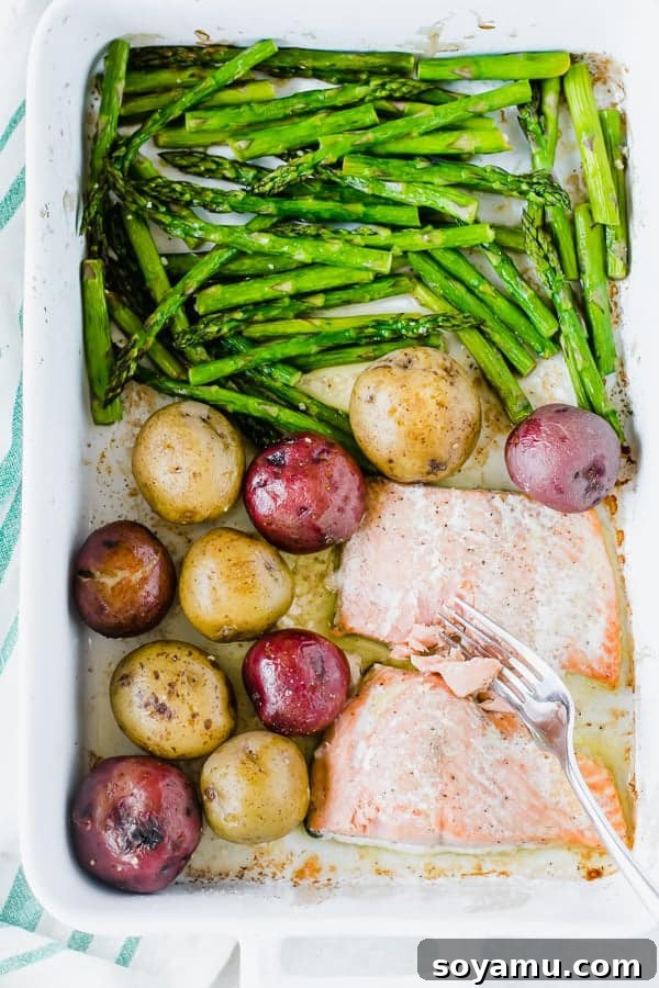 One-Pan Garlic Butter Salmon Dinner One-pan garlic butter salmon with roasted asparagus and potatoes, ready to serve.