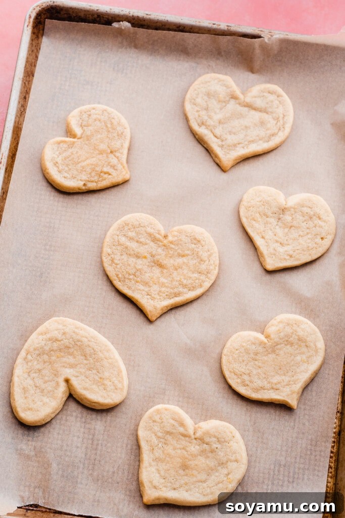 Baked heart cookies on a baking sheet. 