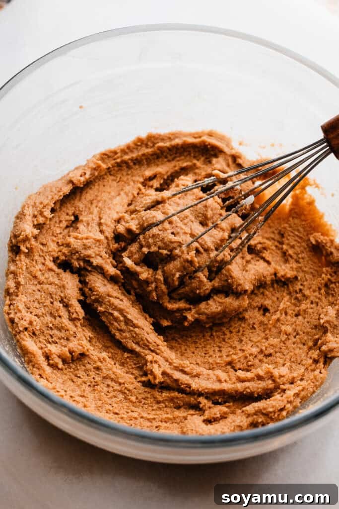 Golden Butterscotch Chocolate Chip Delights 6 A bowl of a thick mixture consisting of the sugars whisked into the butter.