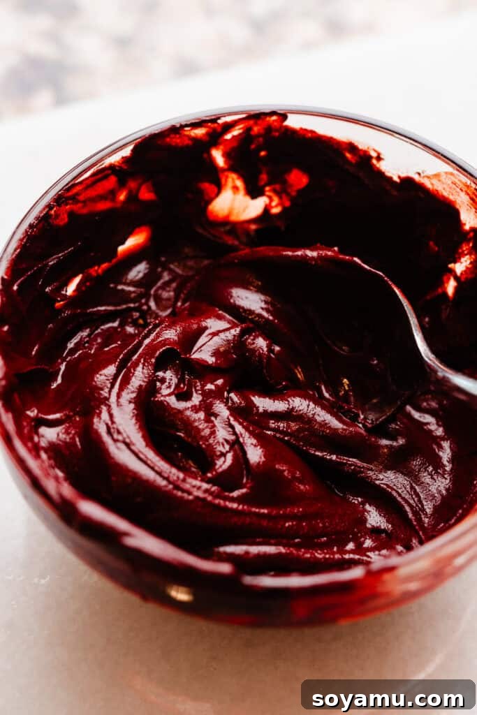 Decadent Red Velvet Dream 4 A bowl of the cocoa paste mixture. It's thick and deeply red colored, ready to be incorporated into the cake batter.