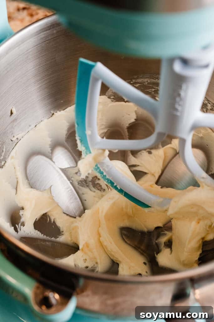 Silky Cream Cheese Frosting Perfection 4 A stand mixer bowl filled with perfectly creamed, fluffy butter, light in color and airy in texture.