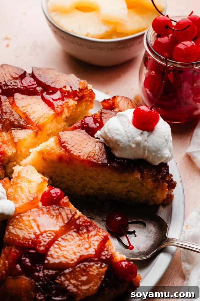 Caramelized Pineapple Dream 12 Slices of the pineapple upside down cake on a cake plate, topped with whipped cream and maraschino cherries.