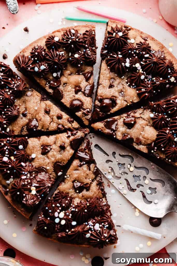 Chocolate Chip Cookie Cake Recipe — Soft, Chewy, Crowd-Pleasing 11 A close-up on the sliced cookie cake, from a bird's eye view.