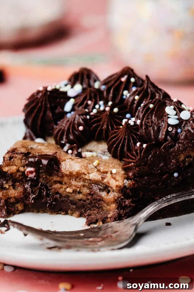 Chocolate Chip Cookie Cake Recipe — Soft, Chewy, Crowd-Pleasing 10 A close-up of a slice of the cookie cake, with a few bites missing to show the gooey texture inside.