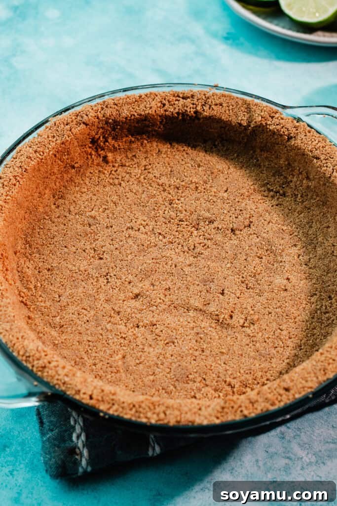 Ultra-Creamy Key Lime Pie Recipe for Perfectly Tangy Slices 6 The baked crust in a 9-inch pie dish.