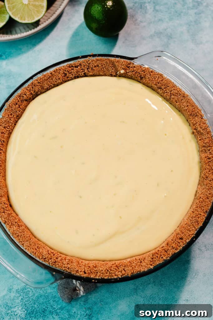 Ultra-Creamy Key Lime Pie Recipe for Perfectly Tangy Slices 10 The crust filled with the unbaked filling, ready for the oven.